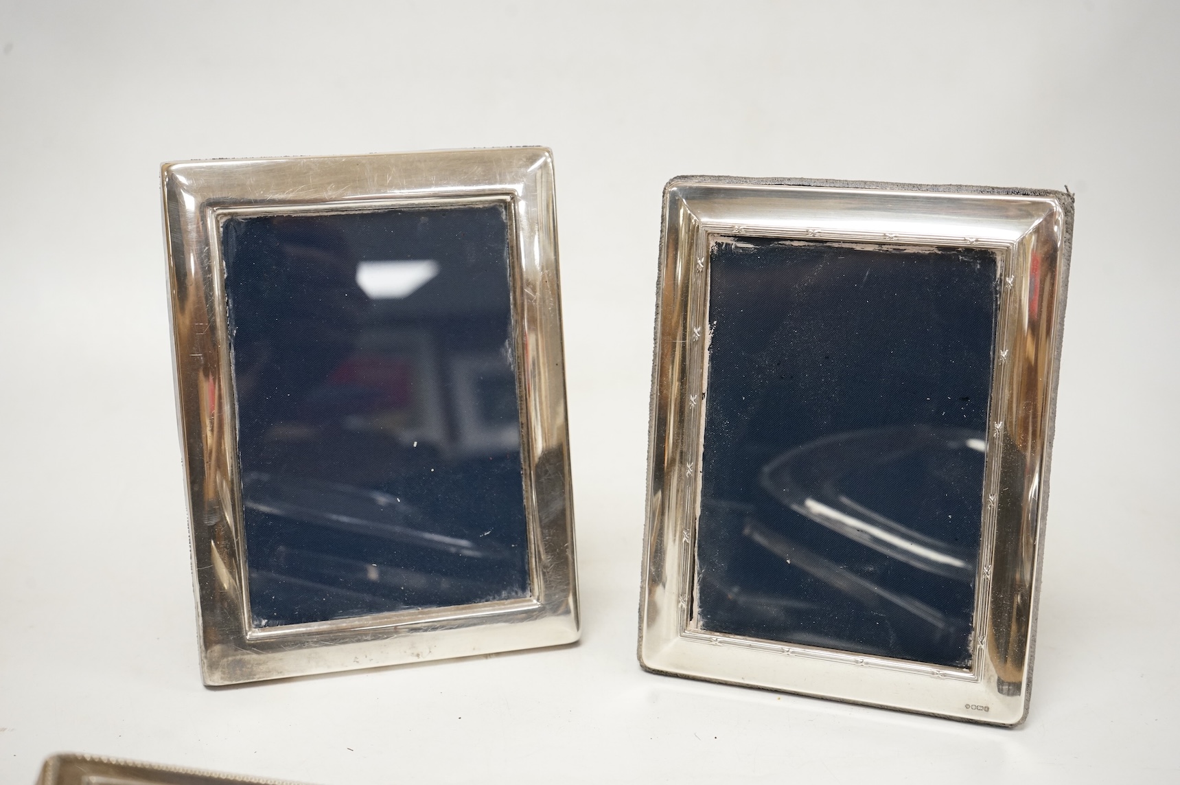A pair of modern engine turned silver mounted rectangular photograph frames, by Carr's of Sheffield, Sheffield, 1992/3, 14.8cm, together with seven other modern silver mounted photograph frames, largest 23.1cm.